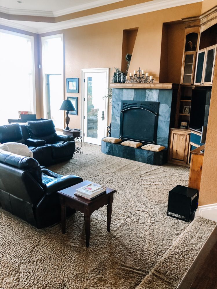 freshly vacuumed living room with huge fireplace