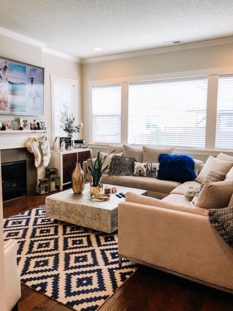 clean modern living room with lots of pillows