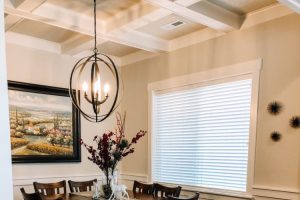 dining area with dark wood dining set hardwood floors and white wainscoting